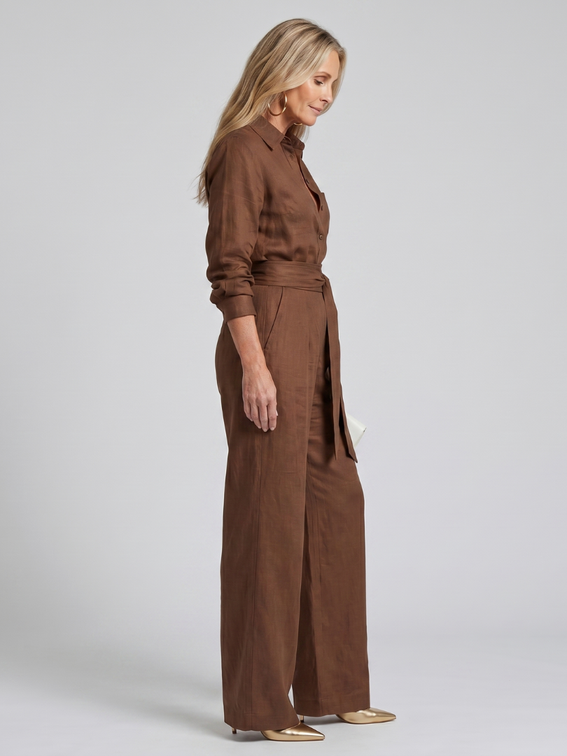 Jovie | Långärmad jumpsuit med knapplist och vida ben
