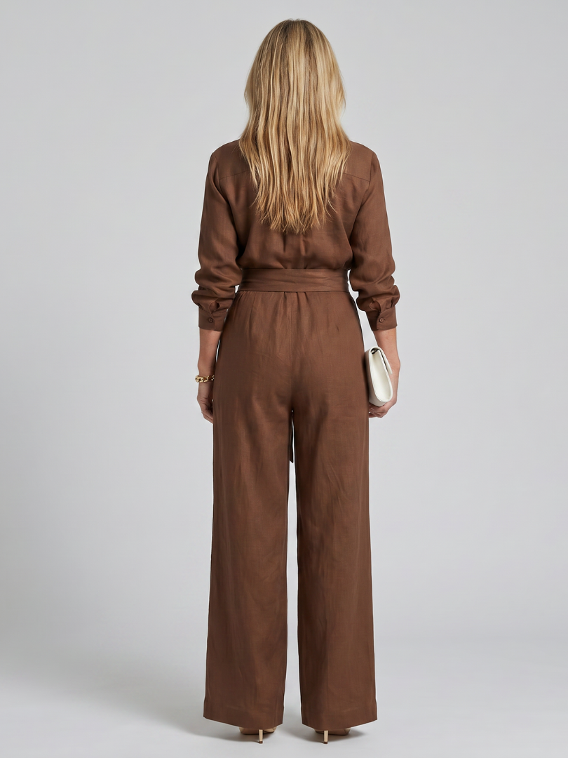 Jovie | Långärmad jumpsuit med knapplist och vida ben